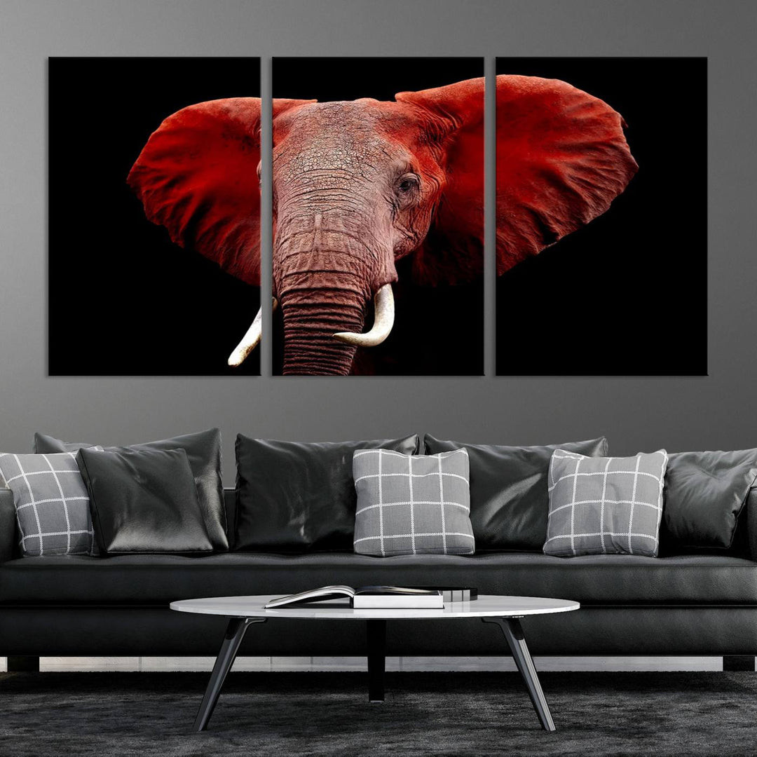 A Wall Art Canvas Print in the modern living room features a three-panel premium design of a red elephant face.