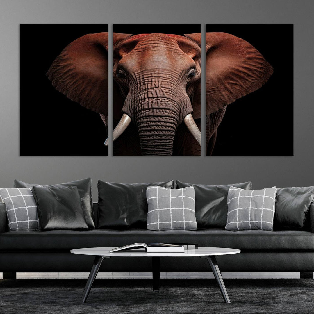 A stunning triptych titled "Wild Elephant Wall Art Canvas Print" beautifully enhances the wall above a contemporary living room. This Africa Savannah Wild Animal Wall Decor Print is of museum-quality, complete with a UV-protective coating to ensure its vibrancy and beauty are preserved for years.