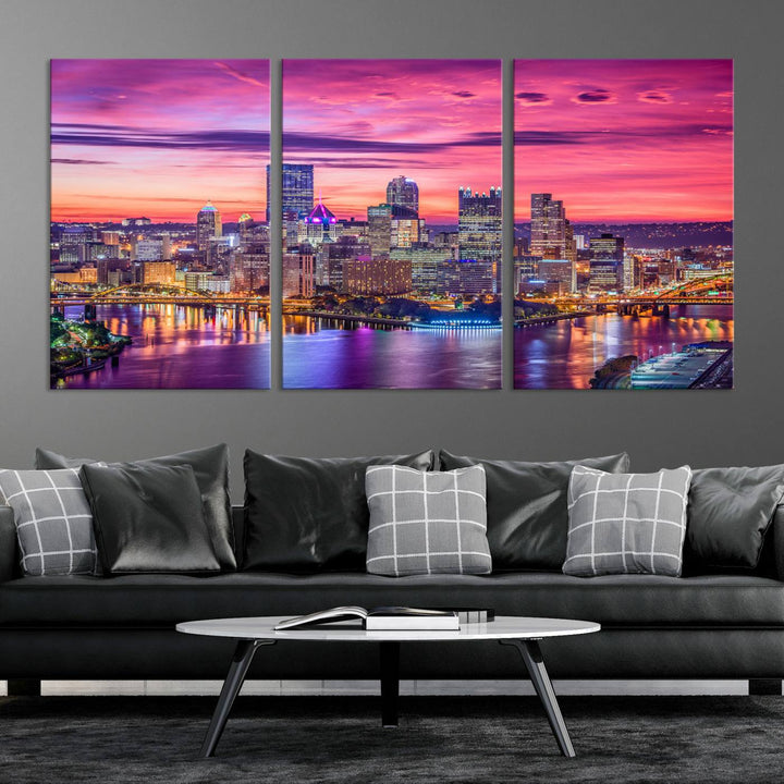 The Pittsburg Wall Art Canvas Print, showcasing a vibrant sunset glow over the city skyline and crafted by a professional artisan, adorns the space.