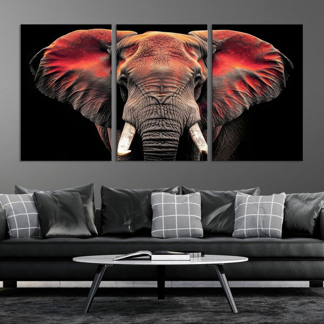 The Elephant Wall Art Canvas Print, featuring vibrant red and black tones, is a stunning artwork printed on museum-quality canvas. It comes with a UV-protective coating.