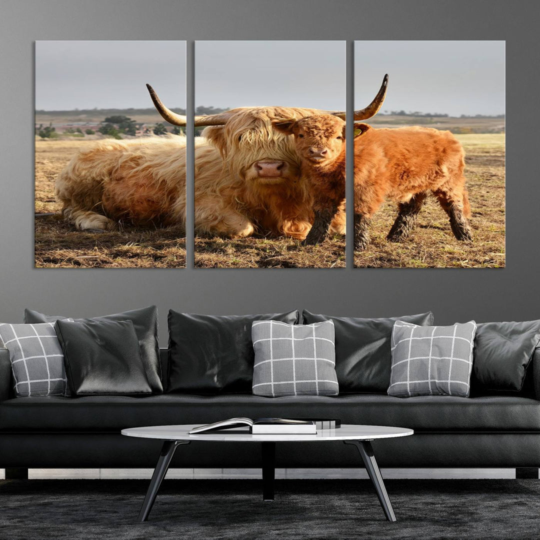 The three-panel canvas artwork, titled "Highland Cow Canvas Wall Art Animal Print for Farm House Decor," features a serene scene of a resting Highland cow and calf in a field. The piece highlights its gallery-quality finish.