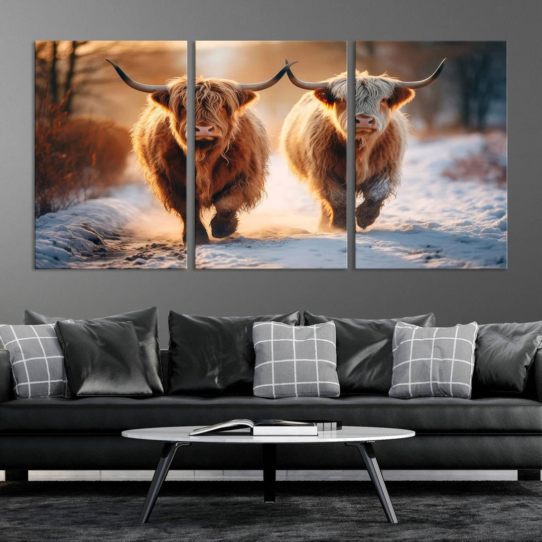 The living room showcases a triptych from the Scottish Highland Cow Horn Farm Wall Art Canvas Print collection, depicting two Highland cows running in the snow. Complementing this are handmade wall art pieces with a gallery-quality finish that add an elegant touch.