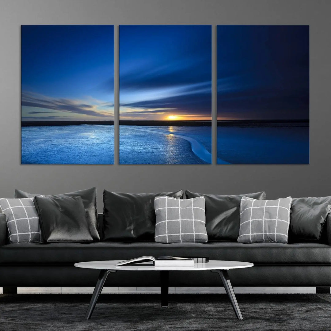 The living room features a triptych of the Wall Art Canvas Print Navy Sunset Lake Landscape Artwork, adding to its tranquil vibe.