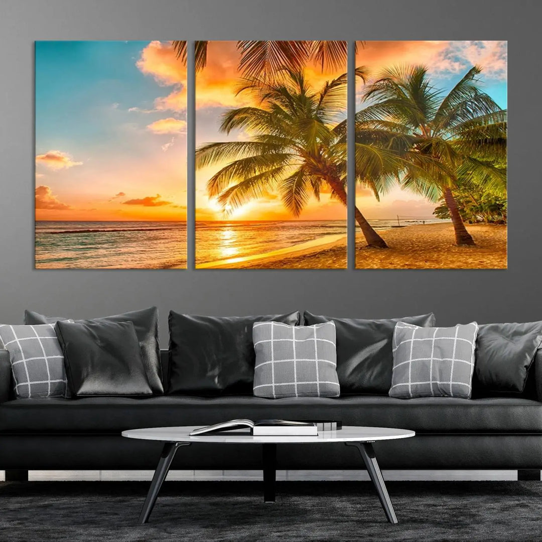 The Tropical Sunset Wall Art Print features a vibrant beach scene with palm trees and an ocean view highlighted by a golden sunset.