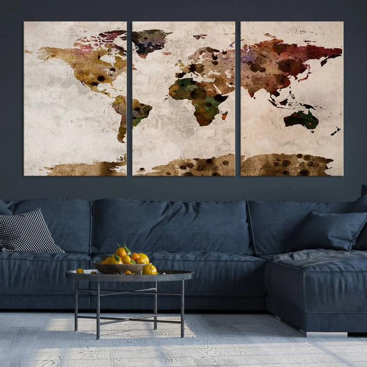 A Watercolor World Map Canvas Print, wrapped in an elegant gallery style, hangs on the wall.