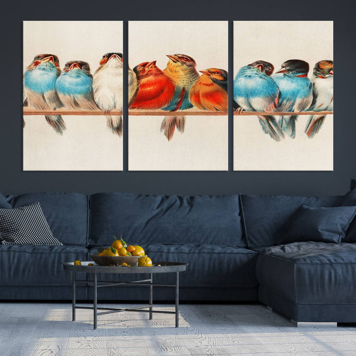 The Abstract Birds Wall Art Canvas Print, featuring a triptych of colorful birds perched on a branch, is printed on museum-quality canvas and equipped with a UV-protective coating and ready-to-hang design. This artwork adds vibrant elegance to your living space.