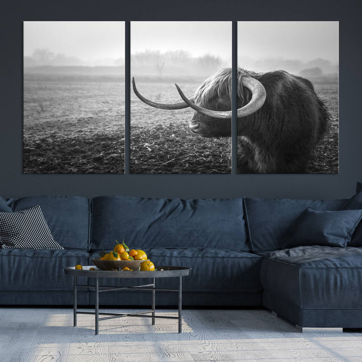 The living room features a three-panel wall art of a highland cow in a foggy field, using the Cow Wall Art Canvas Print for visual impact. This museum-quality canvas includes UV-protective coating to ensure longevity.