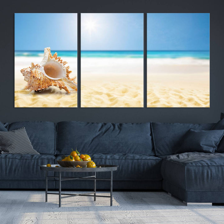 The Sea Shell on The Beach Sun Sand Wall Art Canvas Print is a triptych that beautifully captures a beach scene with a large seashell on the sand.