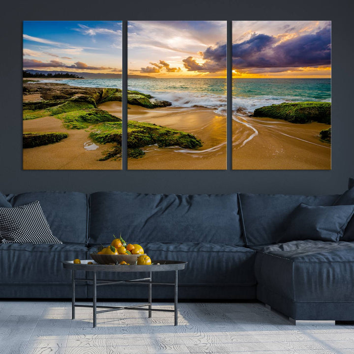 The Sunset Beach Wall Art Canvas Print is a gallery-wrapped triptych showcasing a beach scene with mossy rocks and a vibrant sunset. Made from museum-quality canvas and featuring a UV-protective coating, it elegantly provides both beauty and durability.