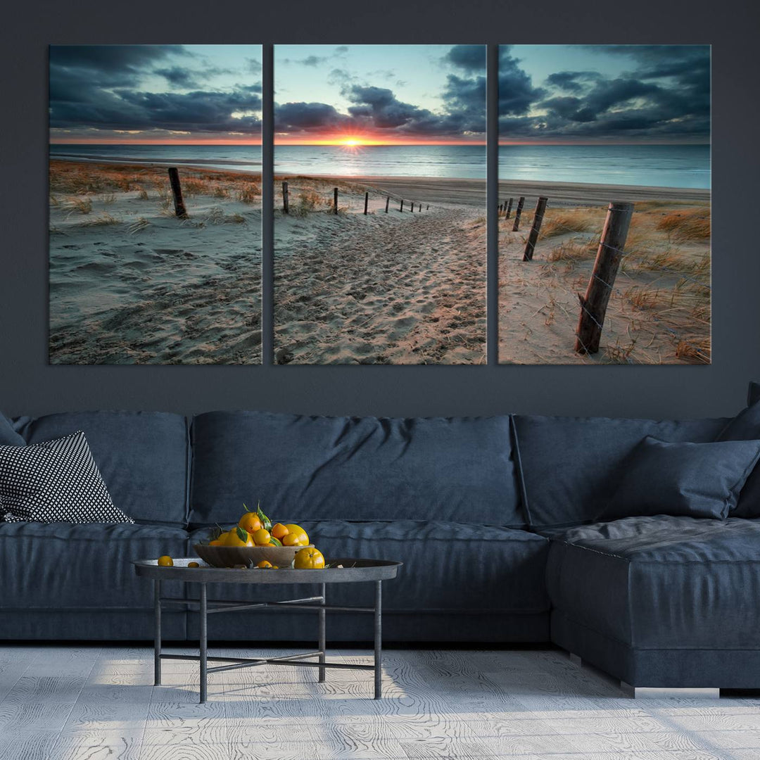 The modern living room features the Cloudy Weather Sunset Beach Wall Art Canvas Print. This museum-quality canvas adds a touch of sophistication with its hand-assembled framed art, ensuring lasting elegance. Enjoy free shipping on this exquisite piece.