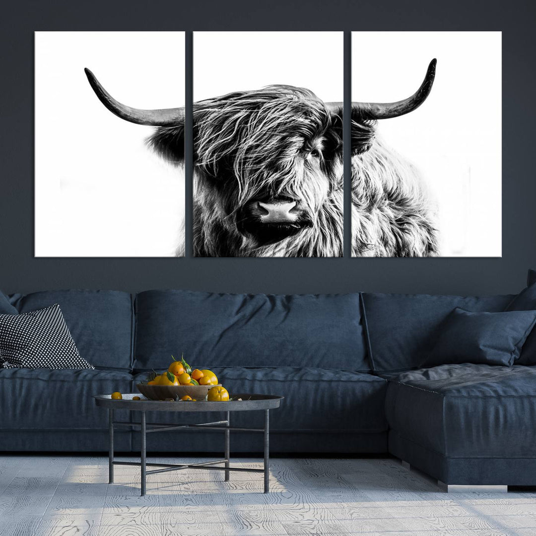 The Scottish Highland Cow Cattle Art Print Farmhouse Wall Art Canvas Print enhances rustic farmhouse decor with its depiction of a long-haired, large-horned cow. This triptych is an ideal choice for chic wall art.