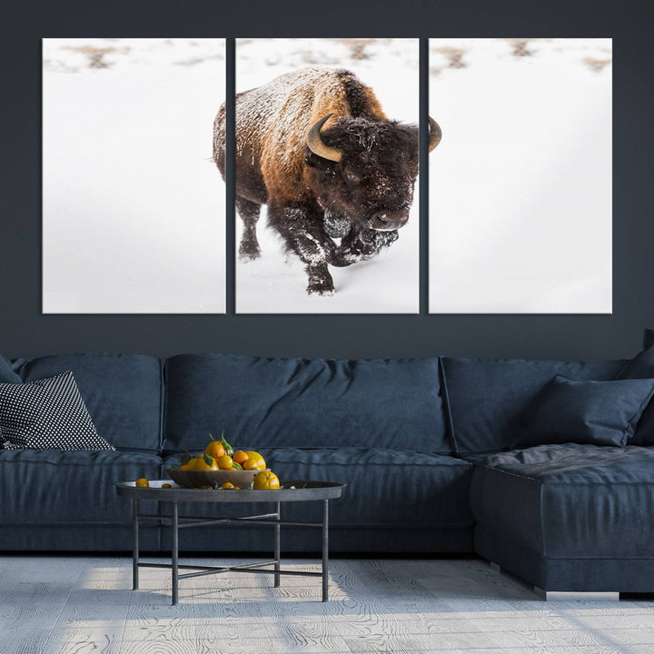 The Bison Winter Wall Art Canvas Print for Farmhouse Decor is displayed as a triptych in the living room. This artwork, printed on museum-quality canvases with a UV-protective coating to maintain its vibrant colors, is the focal point of the space.