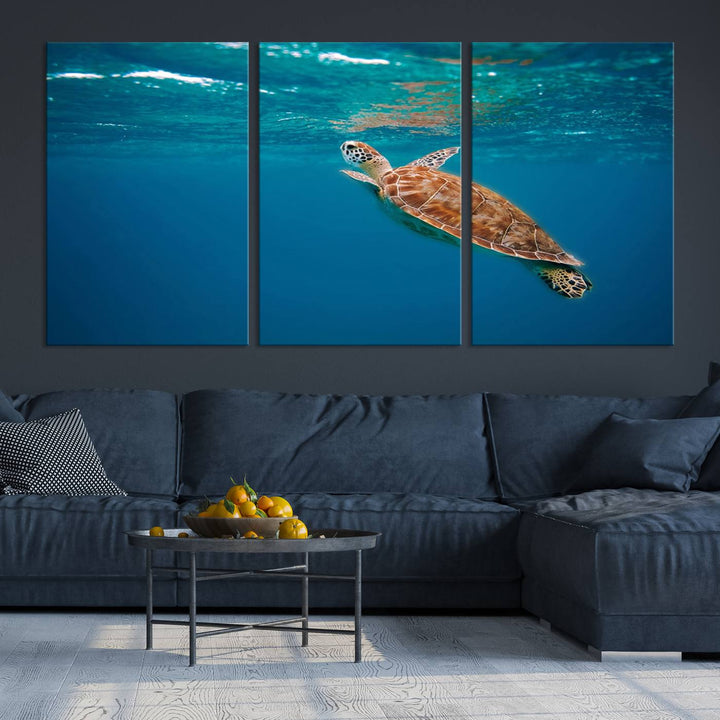 The living room features the "Baby Turtle in Ocean" wall art canvas print. This gallery-quality piece, depicting a sea turtle swimming underwater, adds an elegant touch to the space.