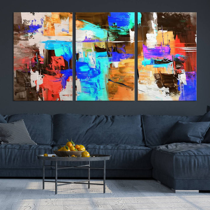 In a modern living room, the "Colorful Abstract Wall Art Canvas Print" serves as a stunning triptych centerpiece on museum-quality canvas, ready to hang. Its UV-protective coating ensures enduring vibrancy.