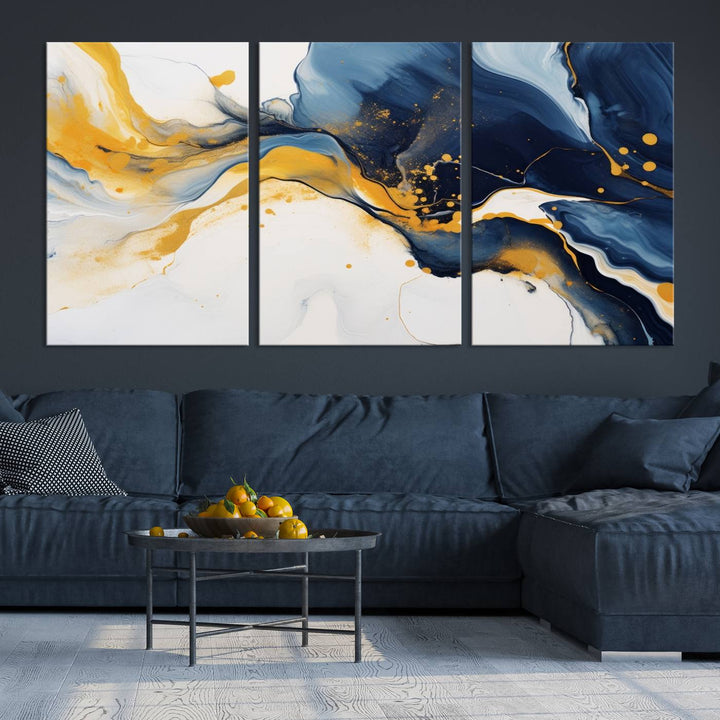 The Blue and Gold Abstract Fluid Canvas Art, with its swirling patterns, adorns the wall. This modern wall art beautifully complements the contemporary interior decor, adding an elegant touch with its rich blue, gold, and white tones.