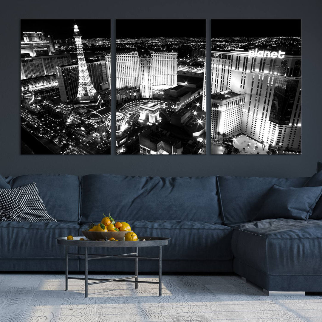 The Las Vegas Wall Art Canvas Print is a black and white triptych that showcases a city skyline at night. Crafted on museum-quality canvas with a UV-protective coating, it serves as an elegant and ready-to-hang focal point in the room.