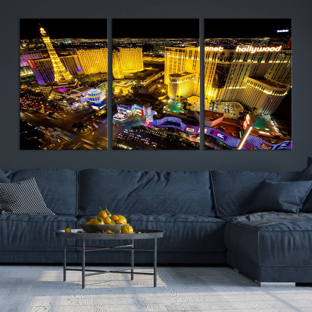 The modern living room features a Las Vegas Wall Art Canvas Print, a museum-quality triptych showcasing a vibrant cityscape with neon lights.