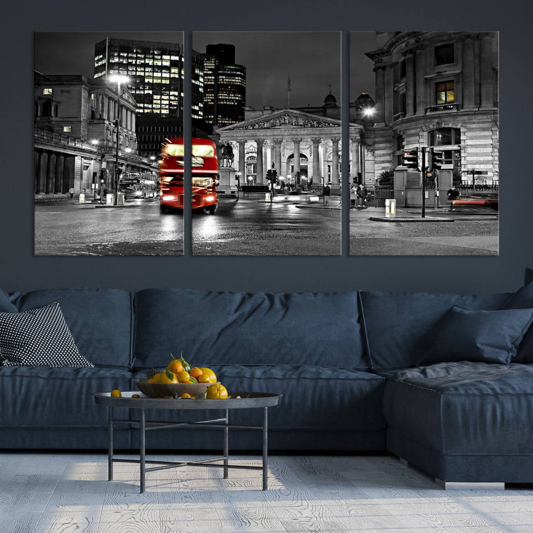 The London Night Red Bus Wall Art Canvas Print features a black and white cityscape with a moving red double-decker bus, crafted on museum-quality canvas with a UV-protective coating. This ready-to-hang artwork is designed to stand out and enhance any space.