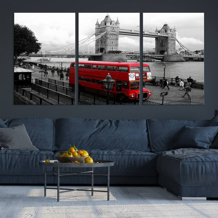 The London Red Bus and Bridge Wall Art Canvas Print showcases a red London bus in front of Tower Bridge, beautifully presented as a gallery-wrapped canvas. This striking image is divided into three panels, delivering a museum-quality display that's ready to hang.