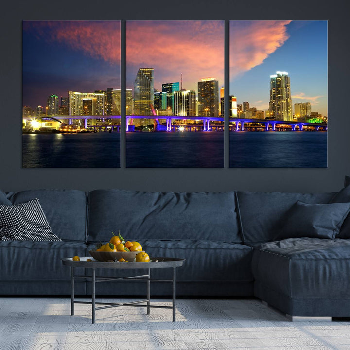 The modern living room is enhanced by the "Miami City Wall Art Canvas Print," a stunning triptych portraying a city skyline at sunset. These canvases are gallery wrapped and made from museum-quality materials, featuring a UV-protective coating to ensure lasting vibrancy.