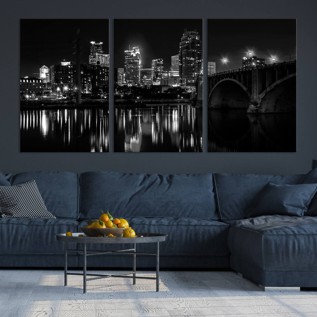 The "Minneapolis Wall Art Canvas Print, Minnesota City Wall Art Print, Minnesota Cityscapes Wall Art" features a black and white triptych of a city skyline with a bridge. Crafted on museum-quality canvas, this gallery-wrapped artwork is finished with a UV-protective coating to ensure lasting beauty.