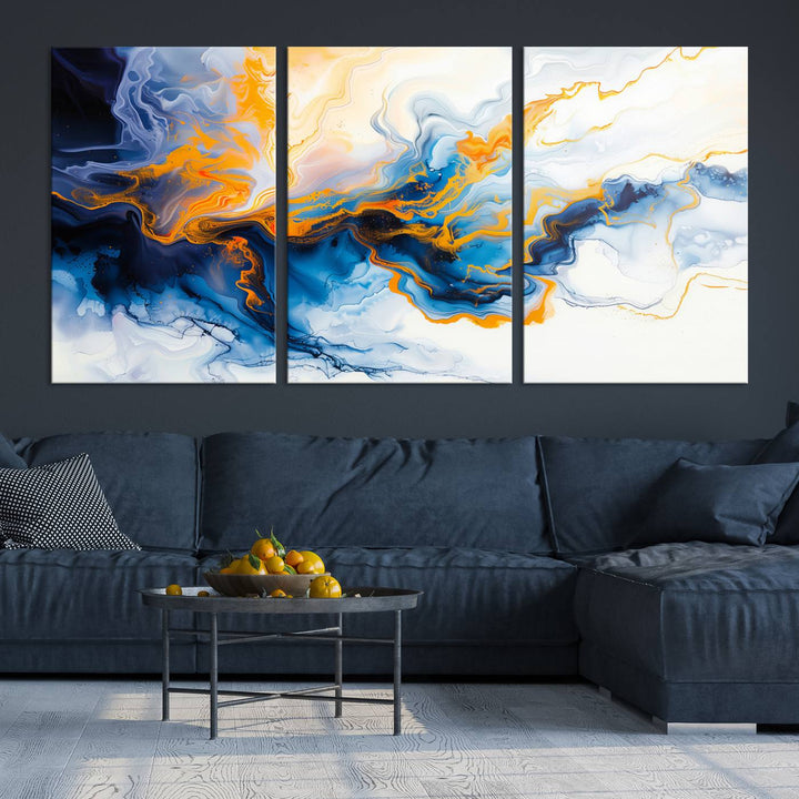 A stunning Fluid Alcohol Ink Wall Art with Gold Wall Art Canvas Print, featuring vibrant blue, orange, and white swirls, adorns the wall. This gallery-quality finish adds an exquisite touch to any living space.