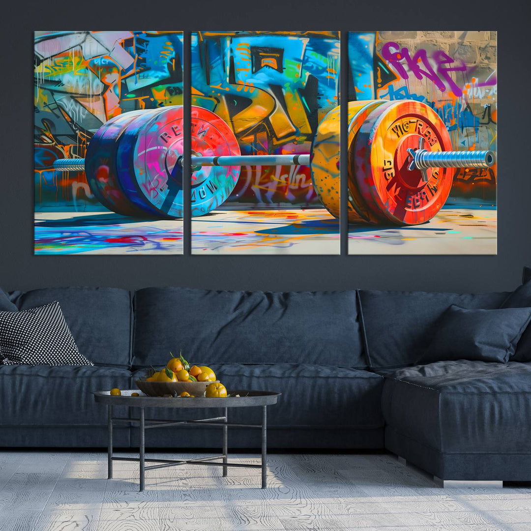 The Fitness Gym Barbell Graffiti Wall Art Canvas Print, a vibrant triptych featuring a barbell against a graffiti backdrop, elegantly hangs in the room. Crafted on premium canvas with a gallery-quality finish, this stunning piece of wall art effortlessly combines urban flair with sophisticated decor.