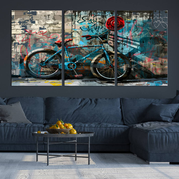 A modern living room features a triptych wall art of an abstract bicycle, designed in a graffiti style on a brick wall. This piece is expertly crafted on the Abstract Bicycle Wall Art Canvas Print, offering a premium canvas that ensures a gallery-quality finish.