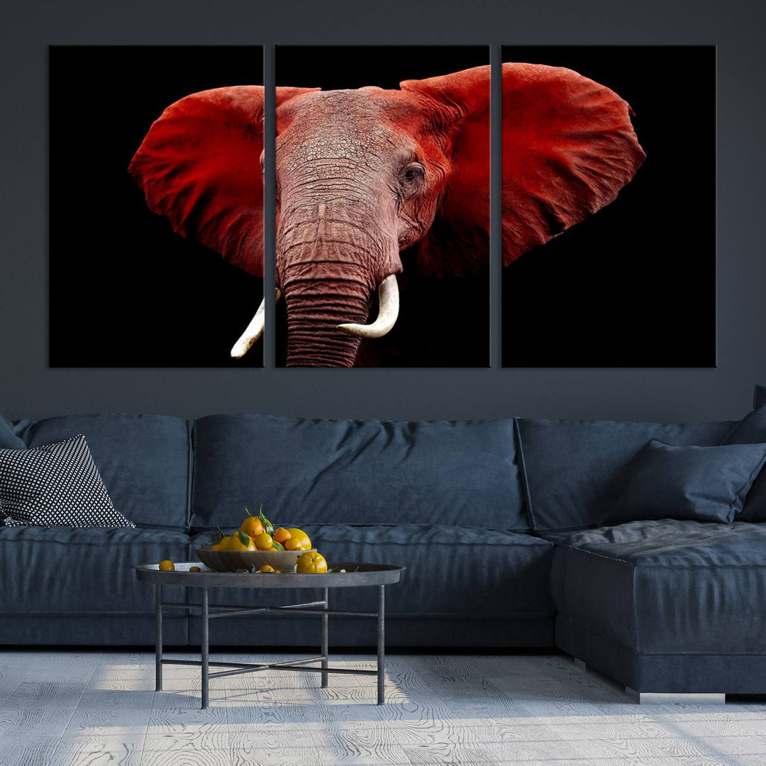 A Wall Art Canvas Print in the modern living room features a three-panel premium design of a red elephant face.