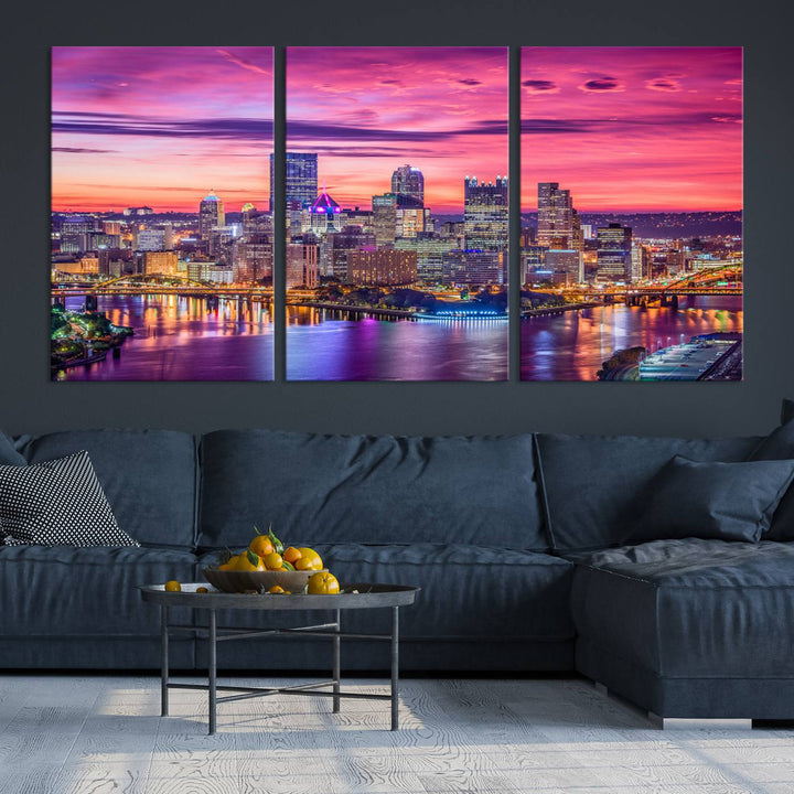 The Pittsburg Wall Art Canvas Print, showcasing a vibrant sunset glow over the city skyline and crafted by a professional artisan, adorns the space.