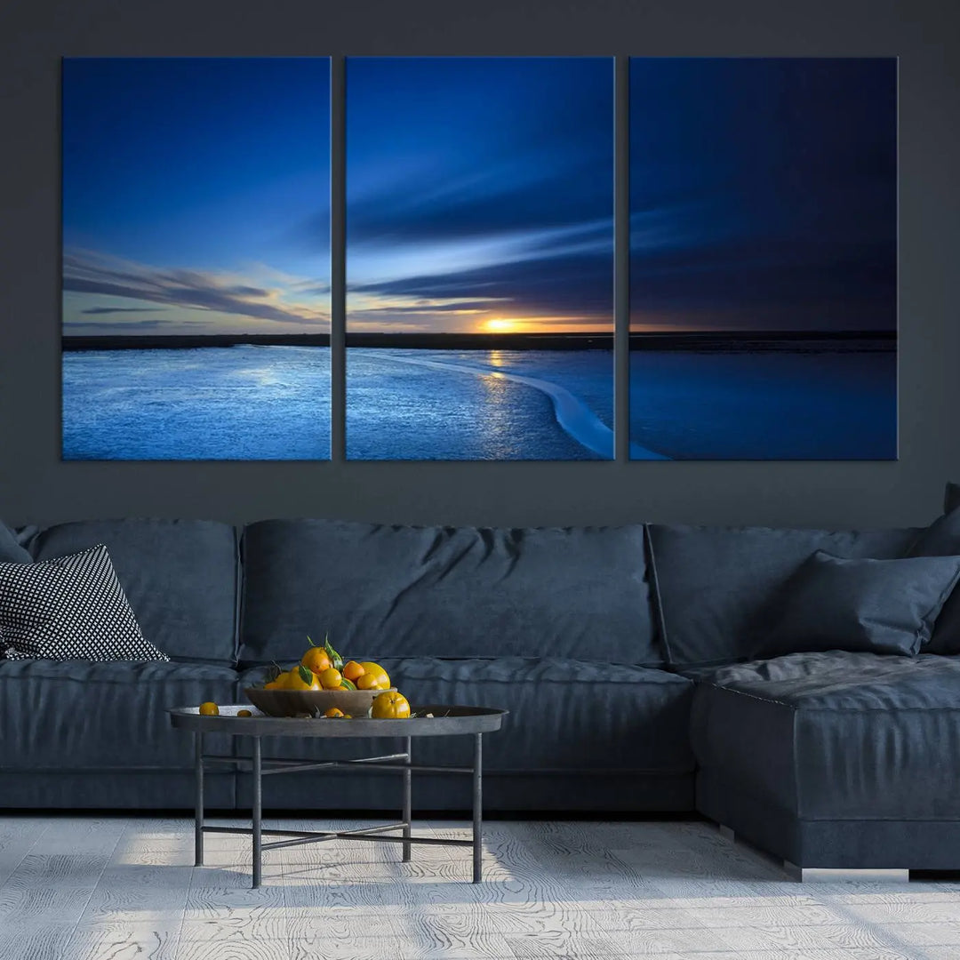 The living room features a triptych of the Wall Art Canvas Print Navy Sunset Lake Landscape Artwork, adding to its tranquil vibe.