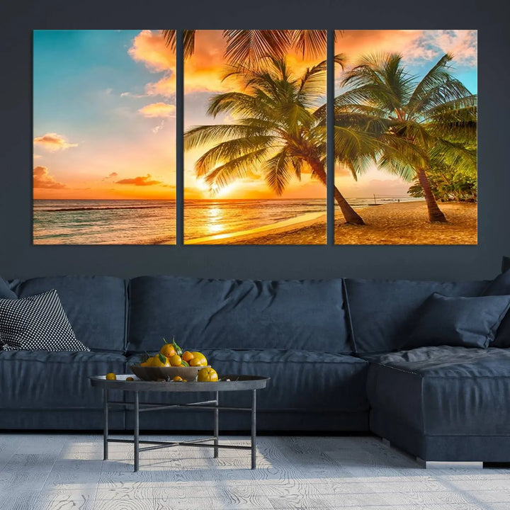 The Tropical Sunset Wall Art Print features a vibrant beach scene with palm trees and an ocean view highlighted by a golden sunset.