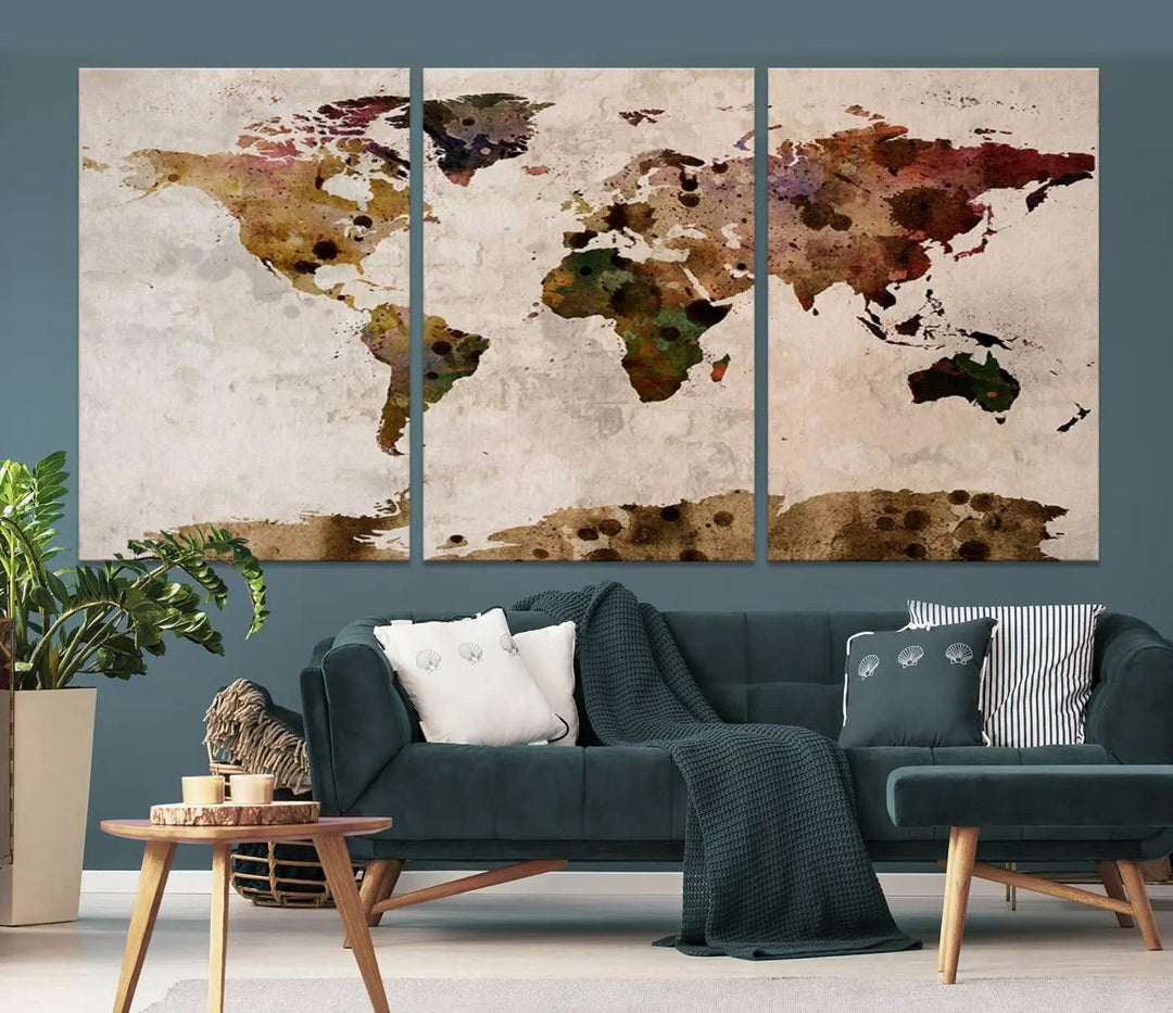 A Watercolor World Map Canvas Print, wrapped in an elegant gallery style, hangs on the wall.