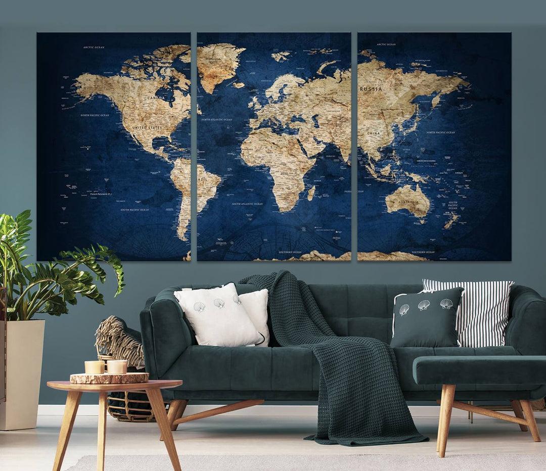 A triptych canvas print titled "Vintage Blue World Map Canvas Print - Classic World Map Design on Deep Blue Wall Art Print" adorns the wall, enhancing the decor with its antique style.