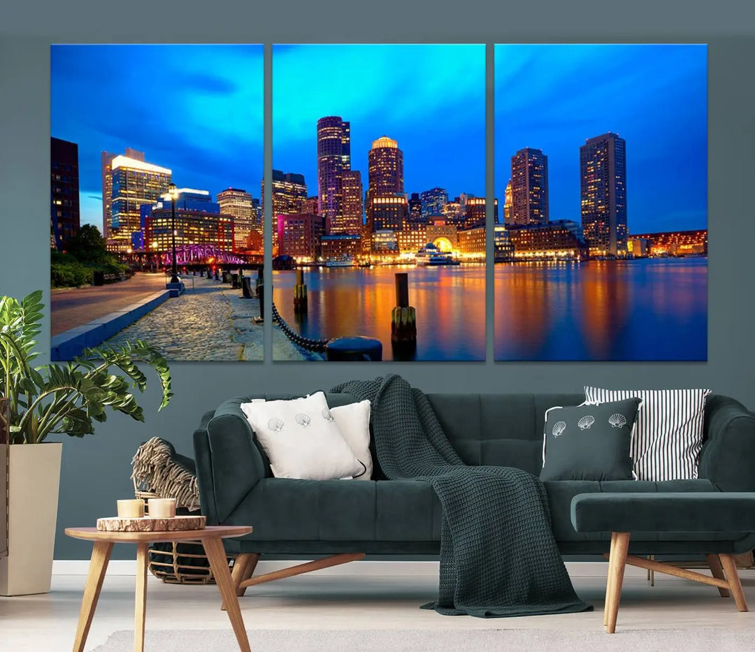 A triptych of the "Boston City Lights Night Blue Skyline Cityscape View Wall Art Canvas Print" adorns the wall. This museum-quality canvas artwork is ready to hang and includes a UV-protective coating for lasting brilliance.