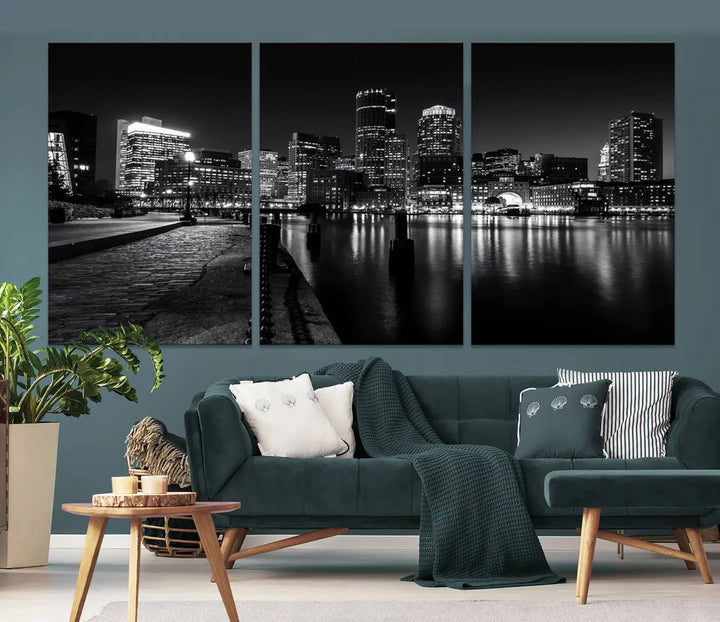 The Boston City Lights Skyline Black and White Wall Art Cityscape Canvas Print portrays a triptych of the city skyline at night reflecting on a calm river. This museum-quality canvas features UV-protective finishes to preserve its timeless allure.