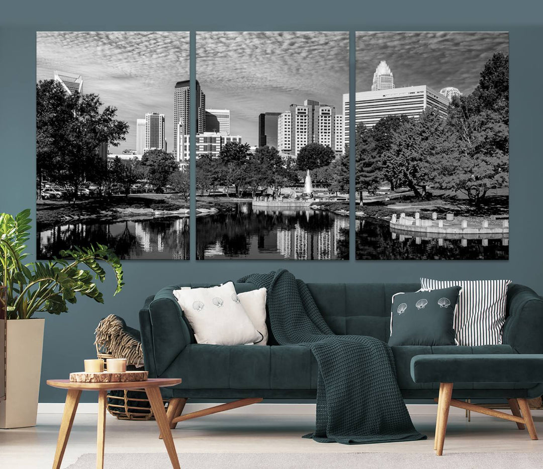 The living room features a captivating triptych titled "Charlotte City Cloudy Skyline Black and White Wall Art Cityscape Canvas Print," crafted on museum-quality canvas with UV-protective coating. Modern decor accentuates the dynamic scene.