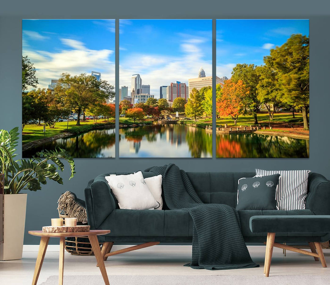 The Charlotte City Park at Spring Skyline Cityscape View wall art canvas print is a triptych featuring a scenic park with a lake and city skyline. It is gallery-wrapped on museum-quality canvases.