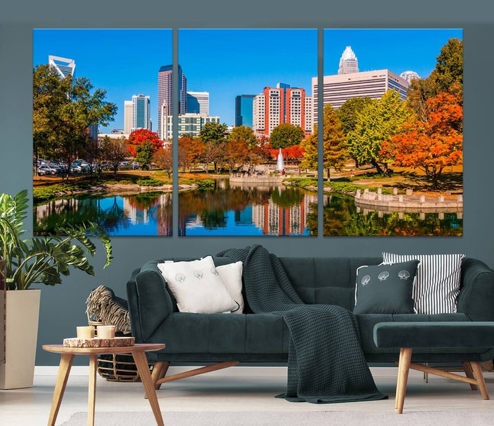 The Charlotte City Park at Fall Skyline Cityscape View wall art canvas print features a city panorama with a park and lake accented by autumn trees. It is mounted on museum-quality canvas with UV-protective coating and decorates the space.