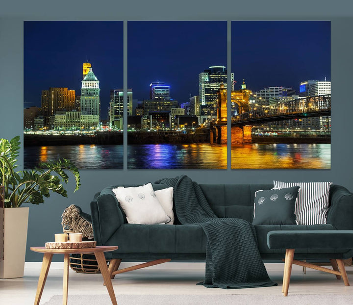 The "Cincinnati City Lights Night Skyline Cityscape" canvas print, displayed above a sofa, exhibits museum-quality craftsmanship with a UV-protective coating.