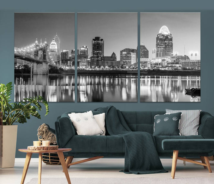 The "Cincinnati City Lights Skyline Black and White Wall Art Cityscape Canvas Print" is elegantly displayed in a stylish living room.