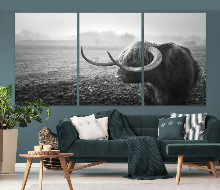 The living room features a three-panel wall art of a highland cow in a foggy field, using the Cow Wall Art Canvas Print for visual impact. This museum-quality canvas includes UV-protective coating to ensure longevity.