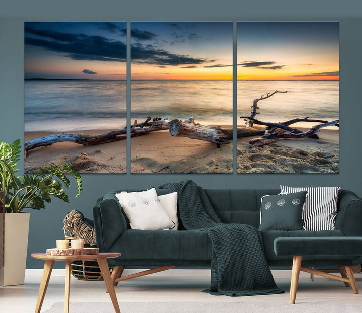 A captivating piece of Ocean Sunset Beach Wall Art Canvas Print, gallery wrapped, graces the gray wall.