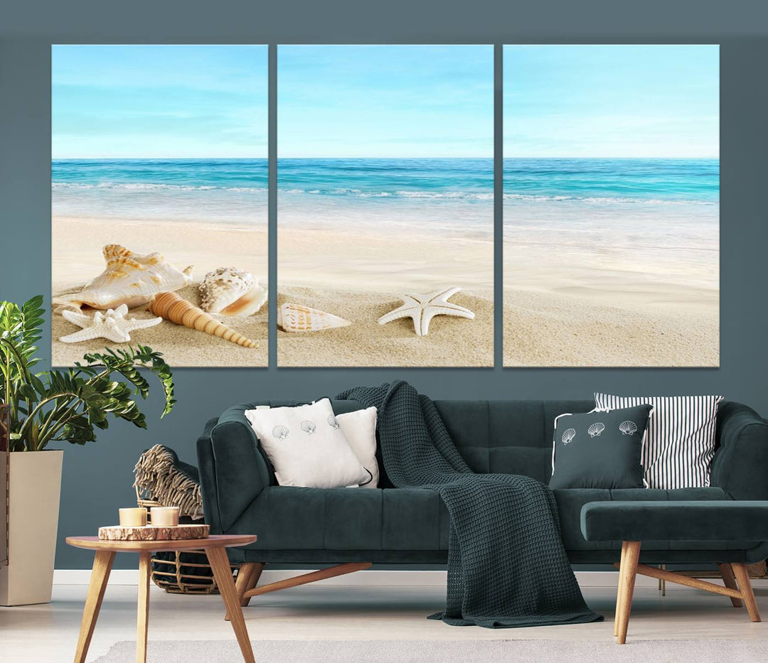 The "Turquoise Ocean View Seashell Starfish on the Beach Canvas Print Artwork" is a triptych piece that showcases a tranquil beach scene, complete with seashells and starfish adorning the sand. It is elegantly gallery-wrapped on museum-quality canvas.