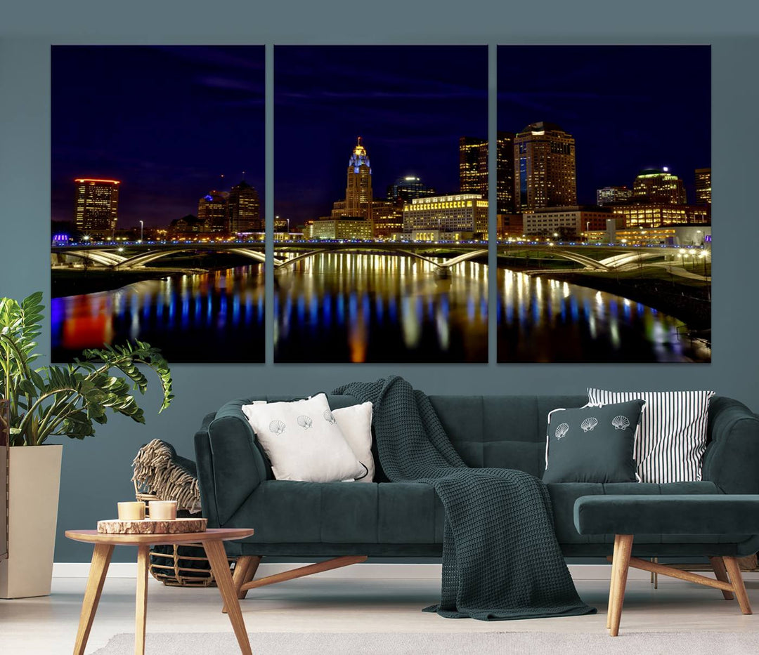 The "Columbus City Lights Night Skyline Cityscape View Wall Art Canvas Print" showcases a stunning city skyline at night, with illuminated buildings and bridges reflecting in the river, on a museum-quality canvas ready to hang.