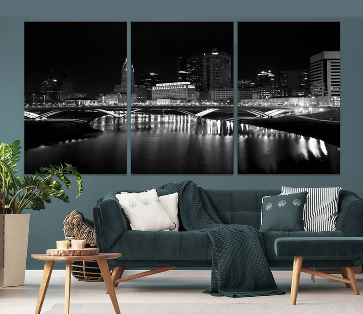 The living room features the "Columbus City Lights Skyline Black and White Wall Art Cityscape Canvas Print" above a coffee table. This artwork is presented as a triptych on museum-quality canvases with UV-protective coating.