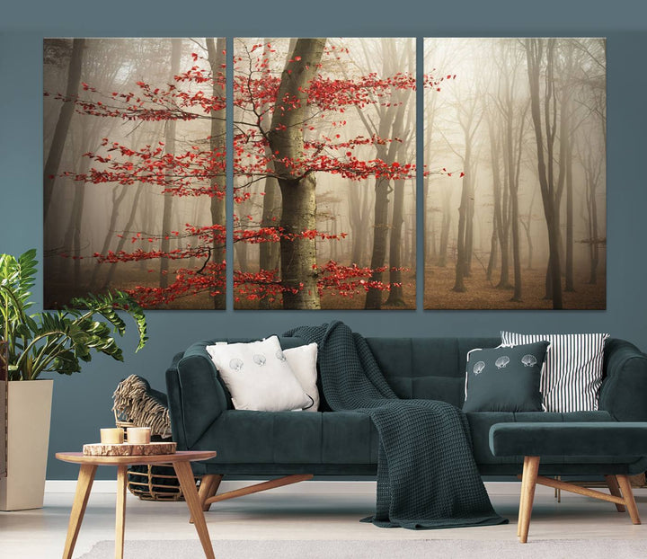 The living room features the Foggy Forest Wall Art, an Autumn Trees Canvas Print that showcases a serene nature scene with foggy woodland decor and a tree adorned in vibrant red leaves.