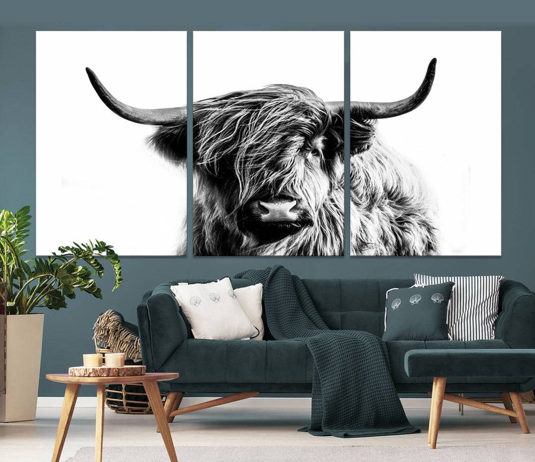 The Scottish Highland Cow Cattle Art Print Farmhouse Wall Art Canvas Print enhances rustic farmhouse decor with its depiction of a long-haired, large-horned cow. This triptych is an ideal choice for chic wall art.