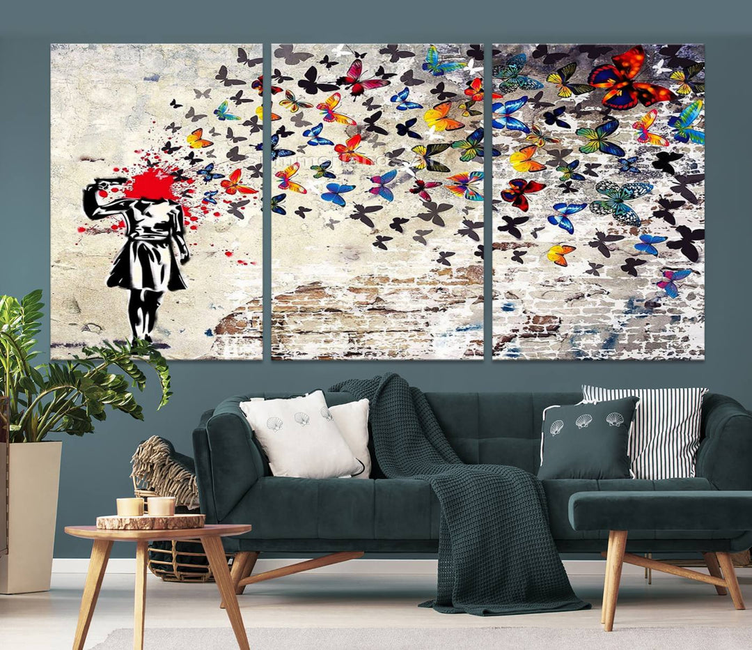 The Banksy Art Butterfly Girl Explosion Canvas showcases a dynamic figure with butterflies bursting from their head, set against a textured wall background. This vibrant urban graffiti piece is perfect for modern interiors and comes ready to hang.