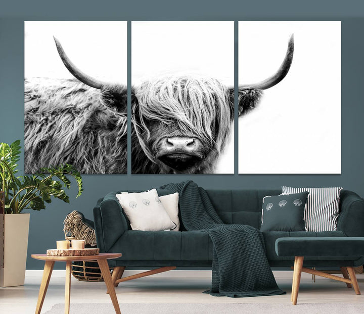 A museum-quality triptych titled "Black White Scottish Highland Cow Cattle Art Print Farmhouse Wall Art Canvas Print" embellishes the dark wall. The canvas is equipped with a UV-protective coating to ensure lasting vibrancy.